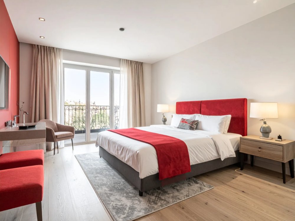 Pokój z czerwonymi akcentami w butikowym hotelu w Madrycie. Zdjęcie wygenerowane przez AI.